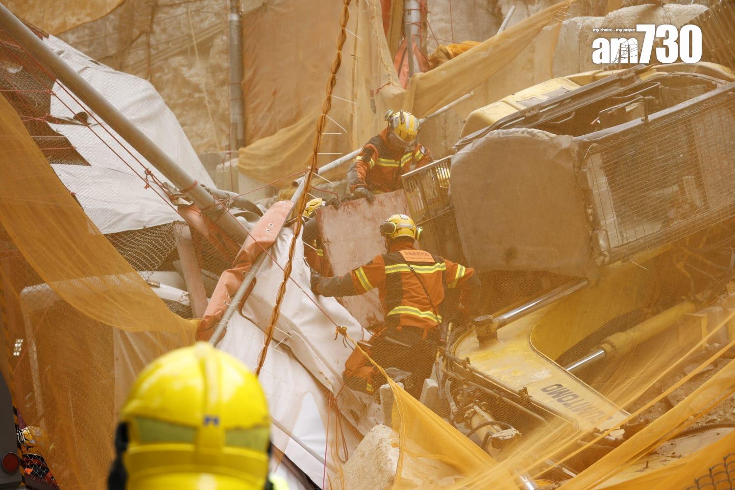 藍田康華苑對開連德道斜坡工地意外,垃圾車內一名乘客被夾車內,消防員正在場拯救。(林俊源攝)