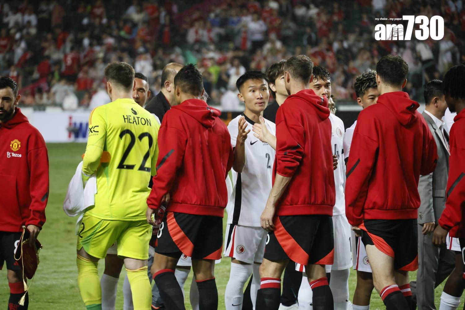 兩隊球員賽前握手。(林俊源攝)