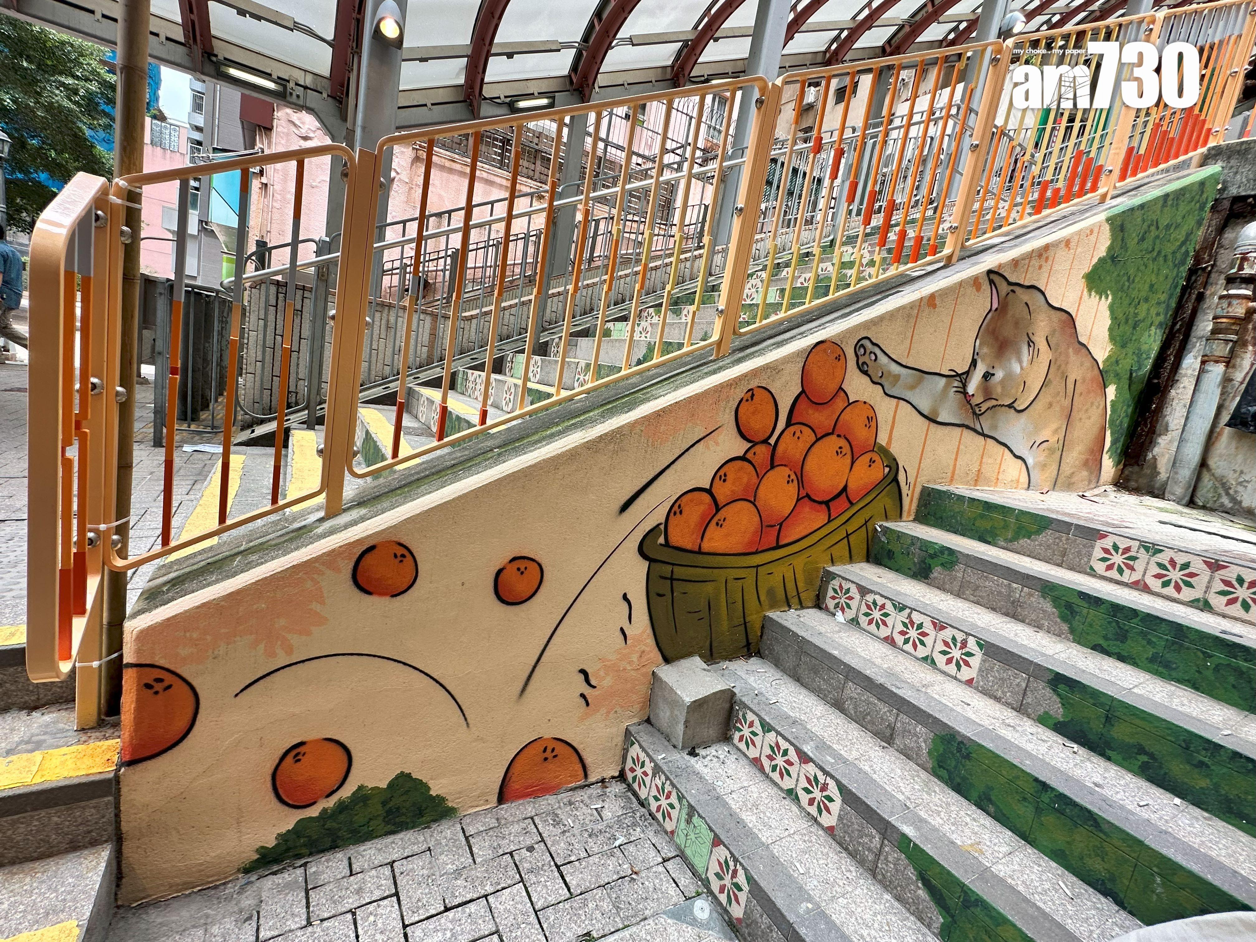 由壁畫師Tim創作、OK便利店旁邊的「貓貓打瀉籮橙」的壁畫故事。(陳穎琳攝)