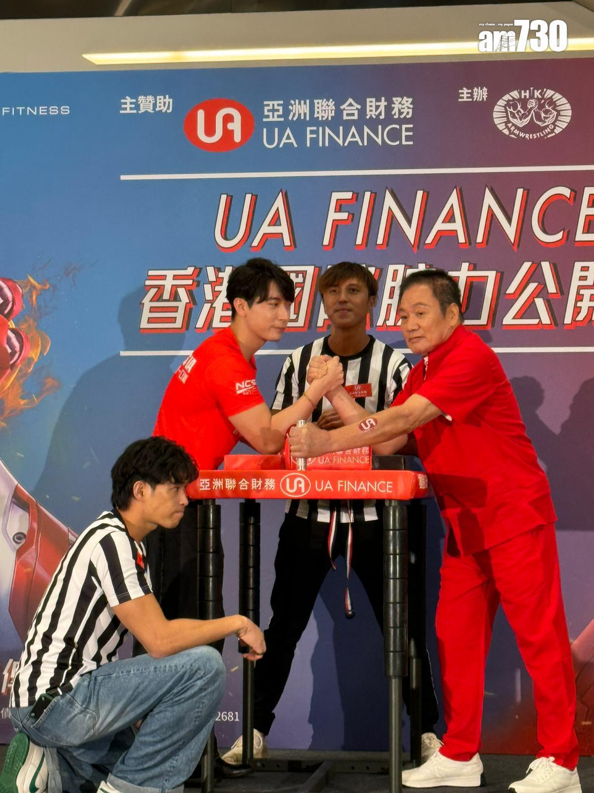 羅莽今次狀態不錯,跟星級健身教練Henry Cho拗手瓜。 (娛樂組攝)