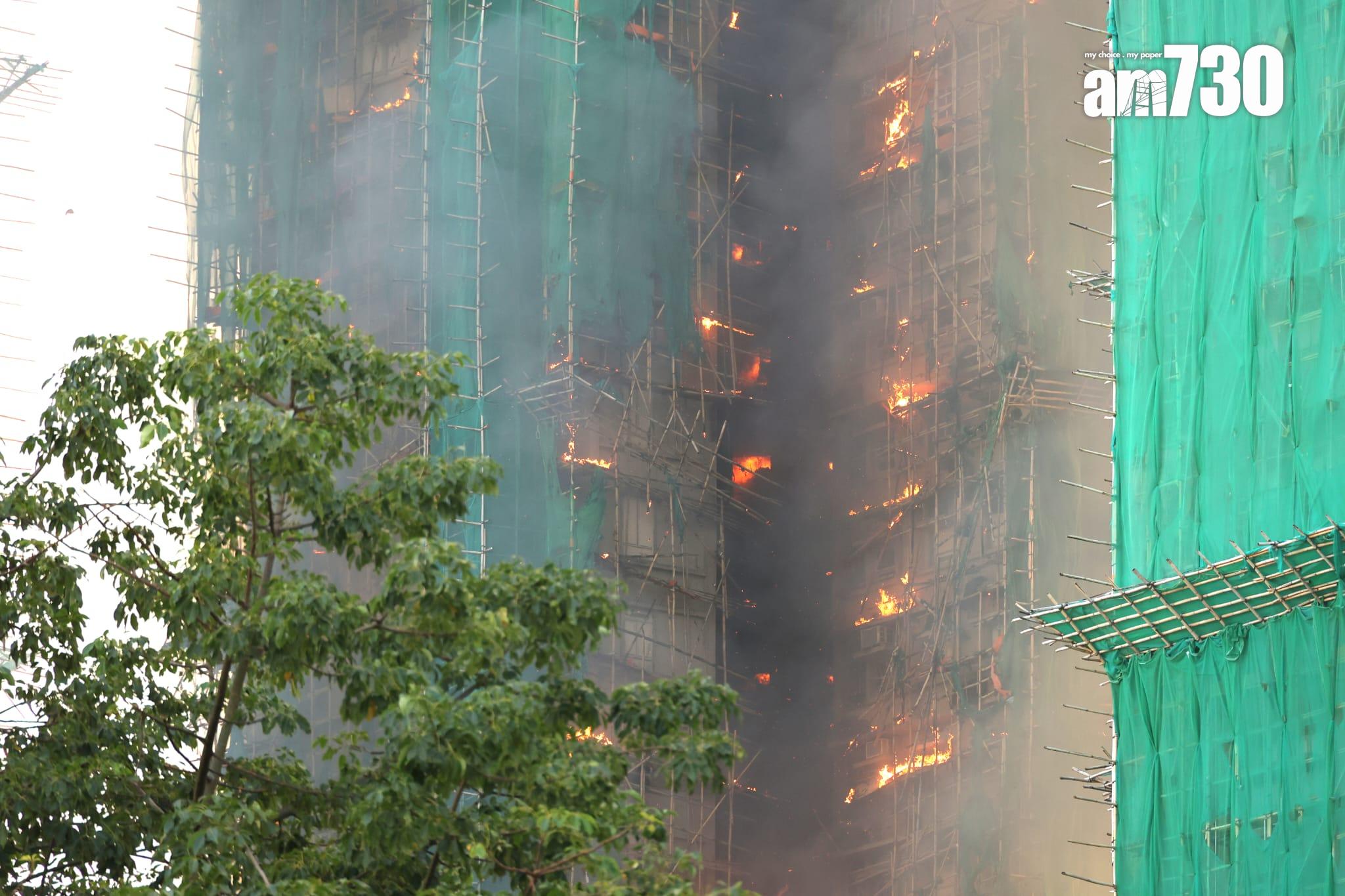 大埔宏福苑宏昌閣外牆棚架起火,消防將火警升為四級。 (林俊源攝)
