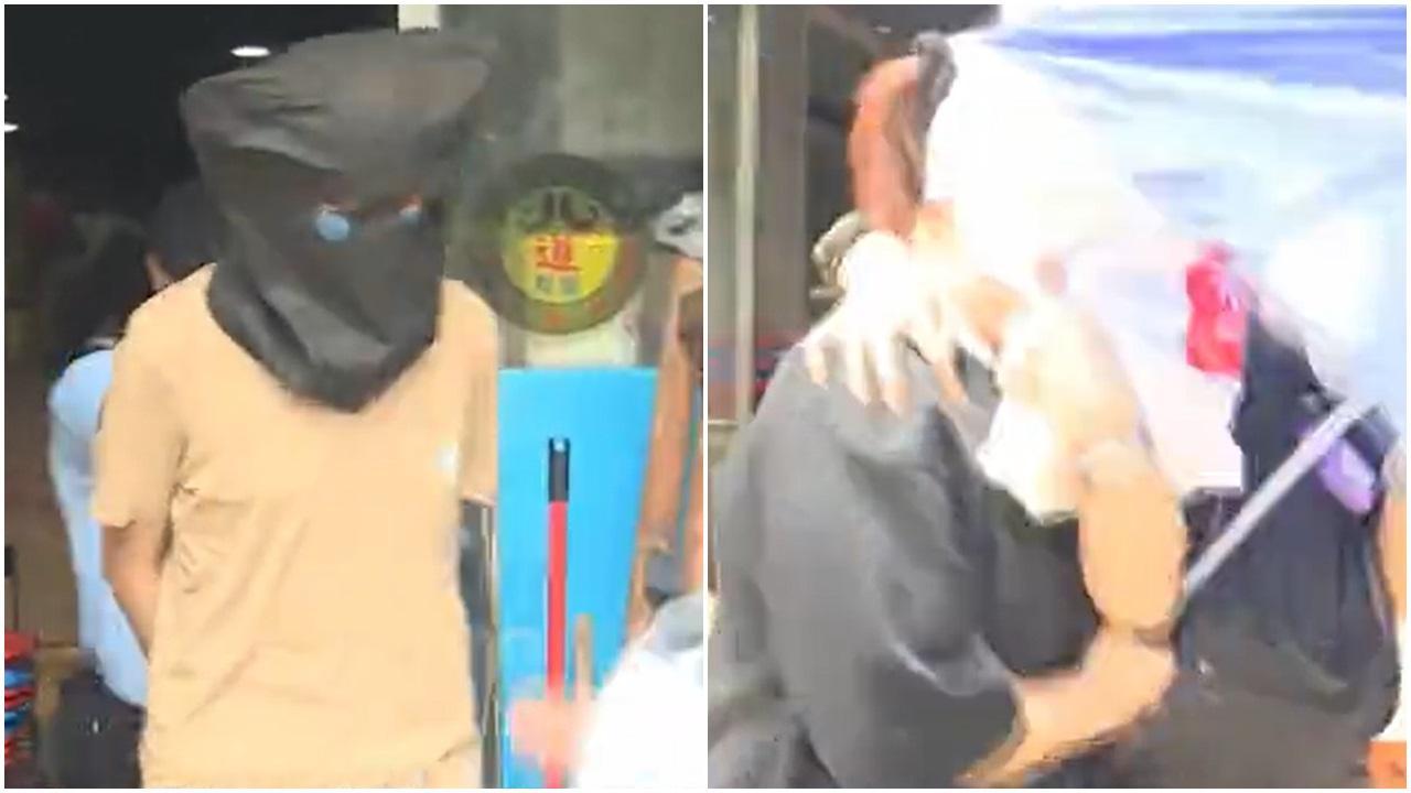 被告(左)當日在慈雲山餐廳內持刀斬傷「黃店」老闆娘。(資料圖片)