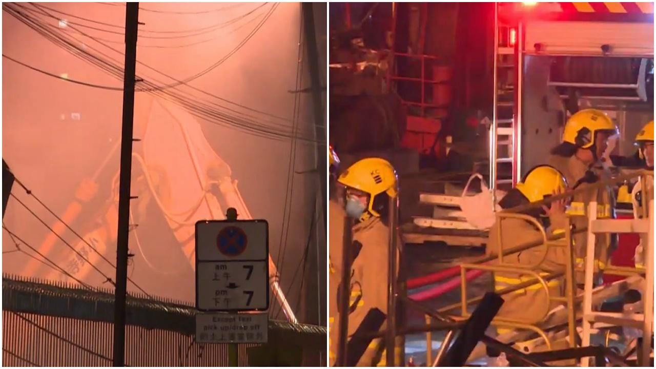 荃灣裝卸區貨物冒煙，疑防潮物品遇雨產生化學反應。(電視截圖)