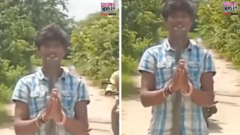 印度20歲男子拍片，挑戰將眼鏡蛇塞入口，咬住站著不動。(互聯網)