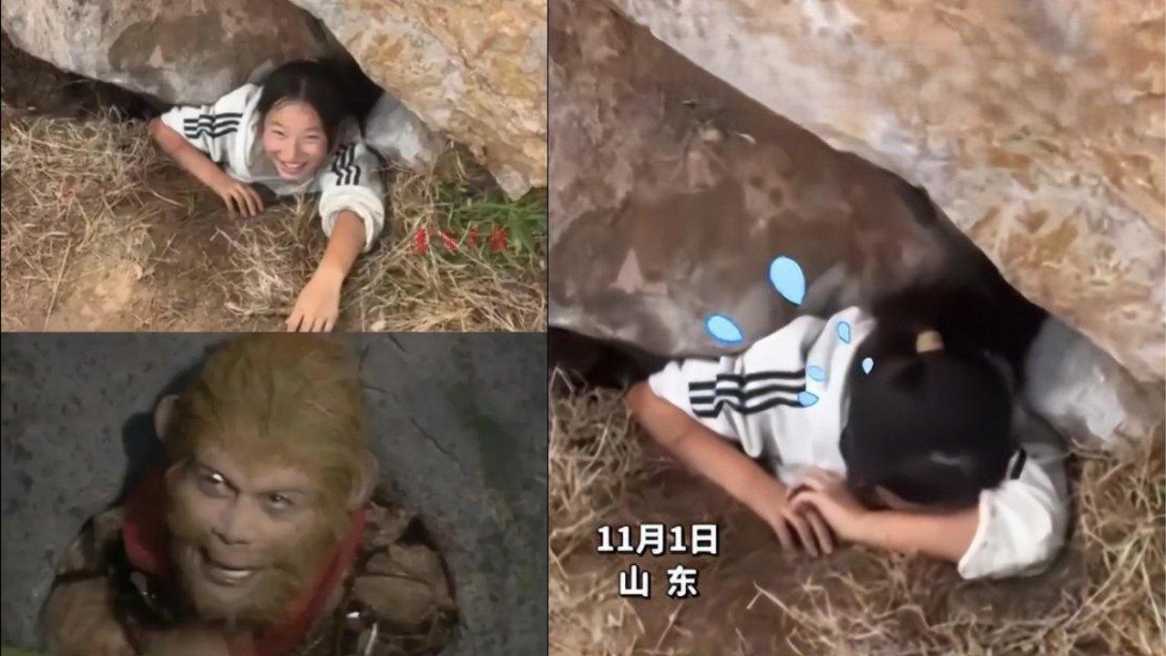 女生執手機被困假山成「五指山下孫悟空」 網民︰現實版西遊記