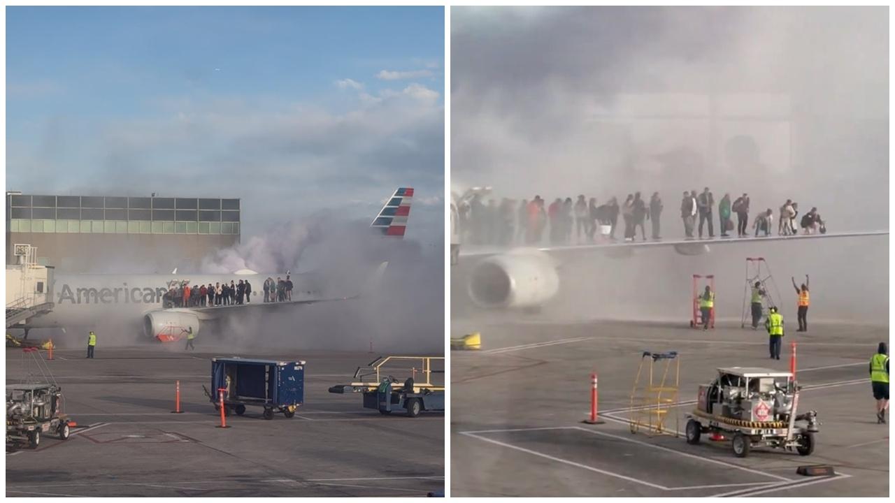 美國航空客機丹佛機場起火，乘客機翼排隊逃生。(X)