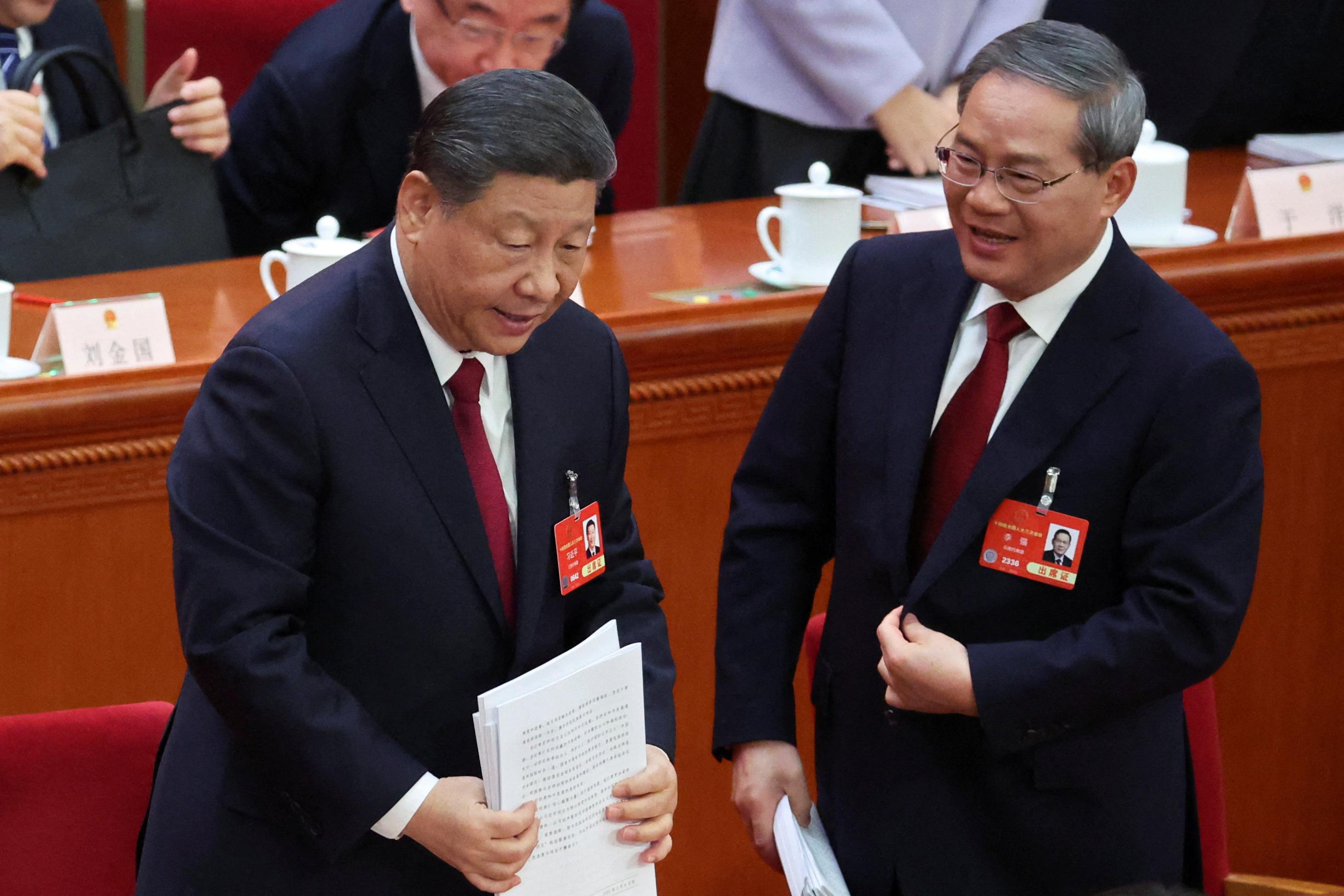 第十四屆全國人大三次會議在北京人民大會堂開幕。總理李強發表任內第二份政府工作報告。中共中央總書記、國家主席習近平在主席台就座。 (路透社)