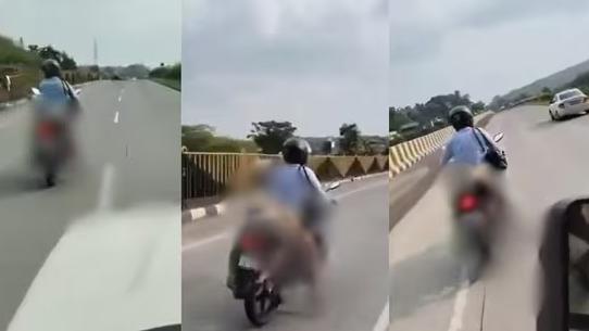 從方車cam拍到亞達夫騎車運送妻子遺體。(互聯網)