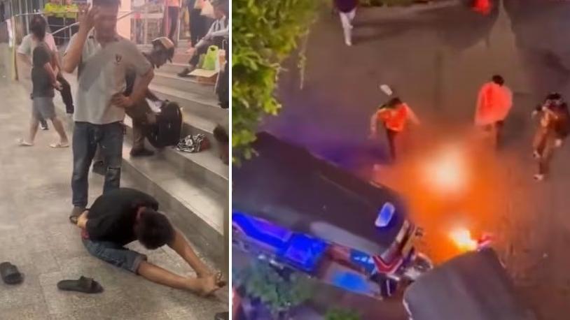 馬來西亞情侶被縱火，現場民眾合力撲救，涉案男子被制服，雙手反綁，等候警員到場。(互聯網)