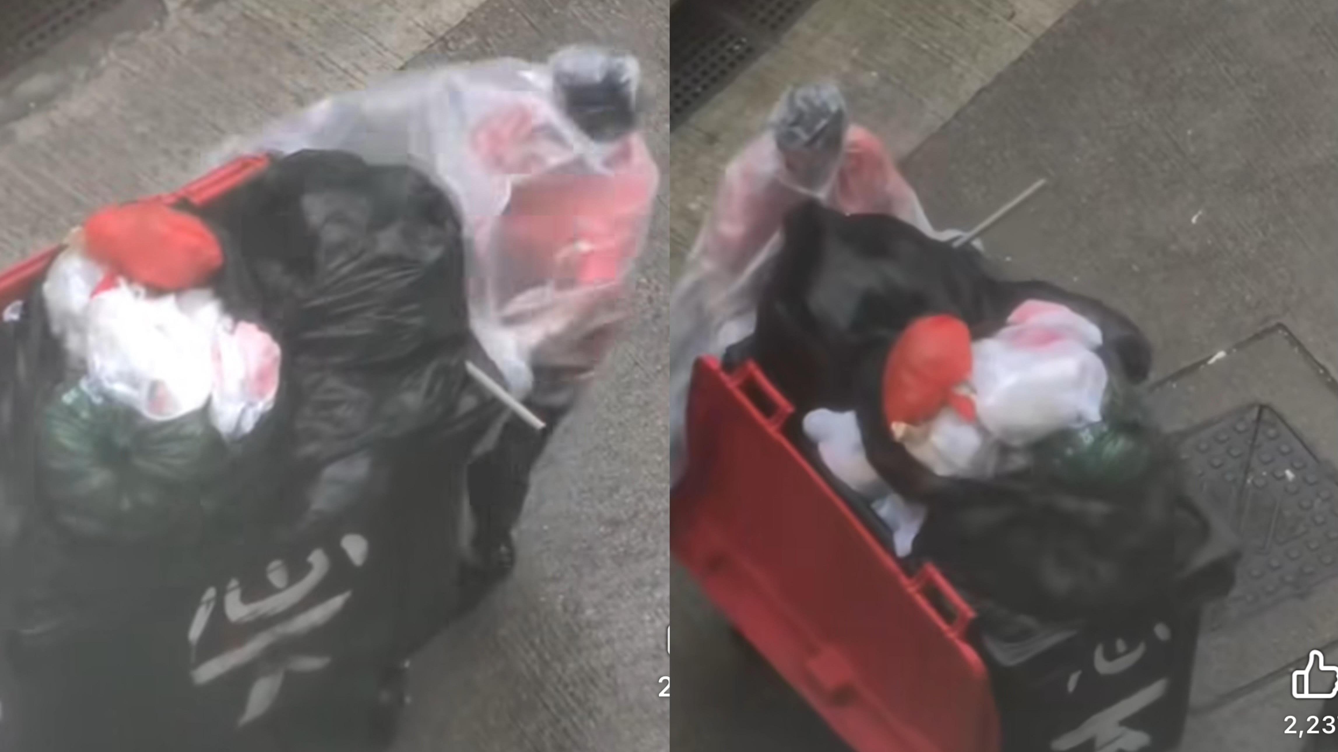 清潔工奮力地拉着垃圾桶。（網上影片截圖)