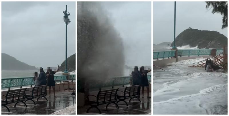 颱風樺加沙｜鴨脷洲海怡半島岸邊，風暴時有兩名女子帶一名男童追風自拍時被巨浪沖跌(影片截圖)