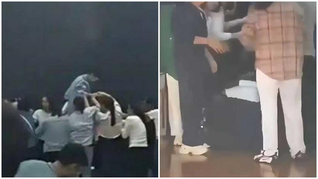 高中生矇眼踩過一排家長背，河南中學「愧疚教育」惹議論。(微博)