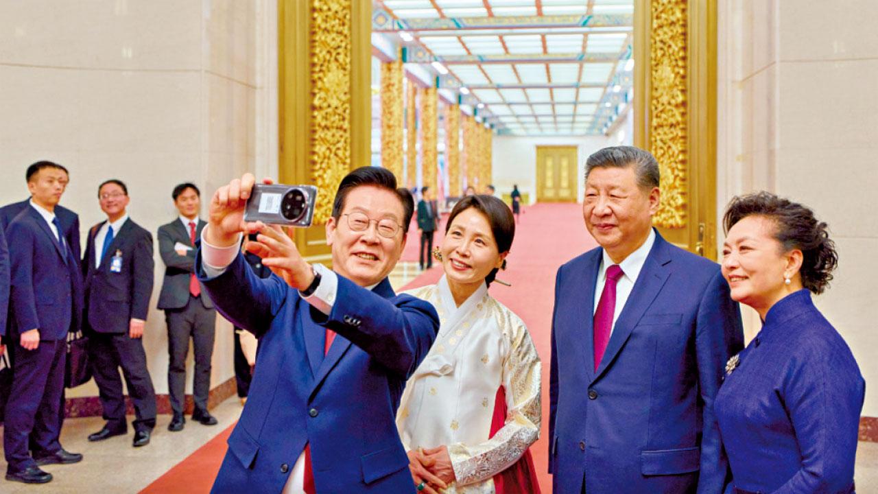 隨身攜帶去年獲贈小米手機訪華 李在明邀習近平自拍 稱獲「人生照片」